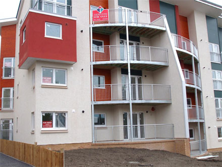 Block of new build flats with steel balconies