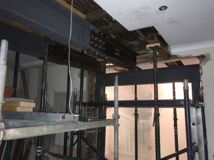 scaffolding inside house with steel beams 