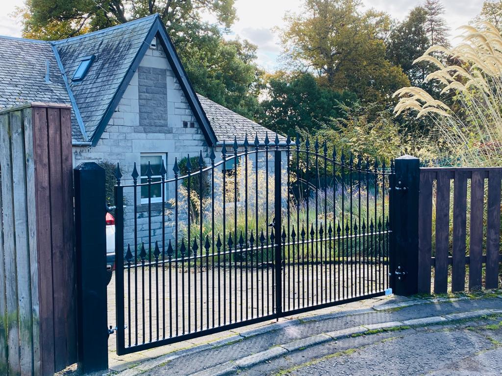 Side View of a closed black automated gate