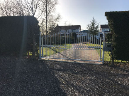 White automated gate 